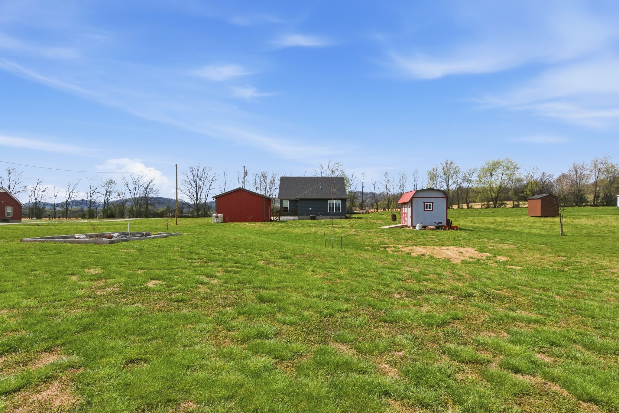 2705 Mc Connell Road Cornersville, TN 37047 - Photo 37 of 41 a swimming pool is in the middle of a field