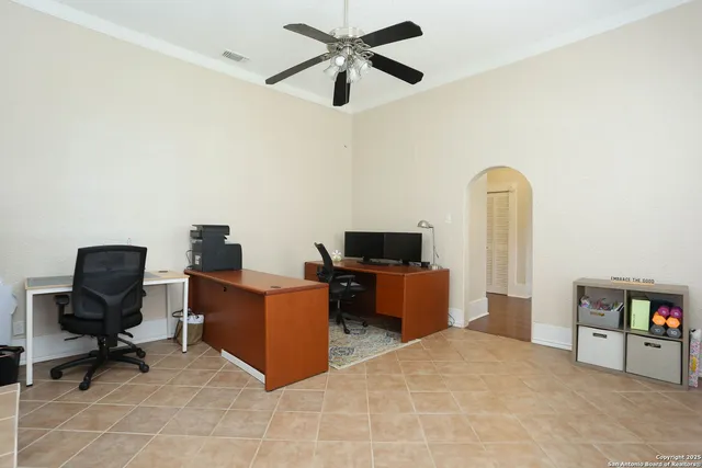 a view of a workspace with furniture