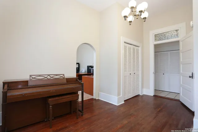 a view of a livingroom with furniture and chandelier