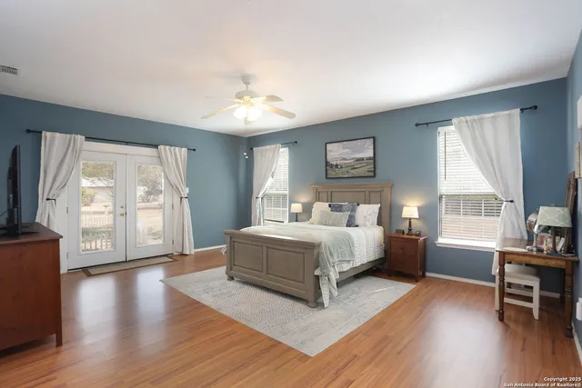 a spacious bedroom with a large bed and a window