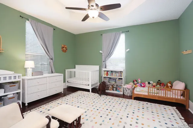 a bedroom with furniture and a window