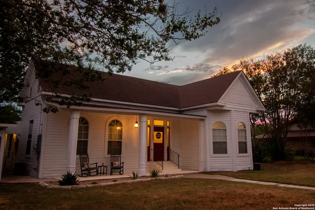 a view of a house with brick walls