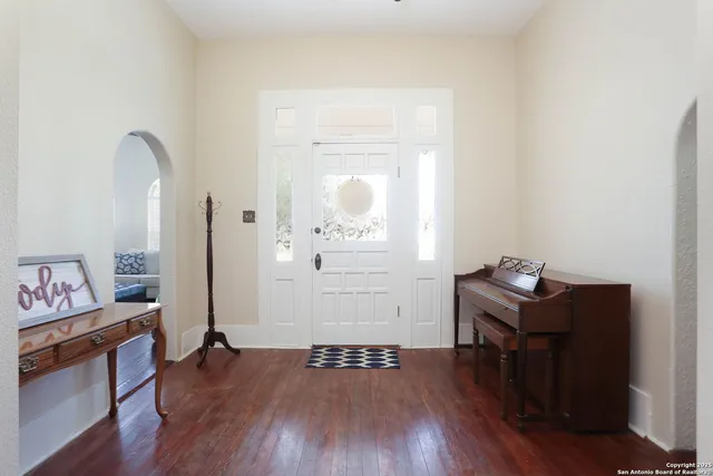 a room with furniture and wooden floor