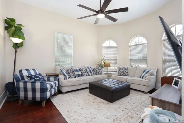 a living room with furniture and a large window