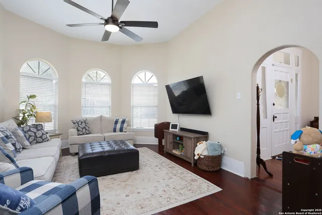 a living room with furniture and a flat screen tv