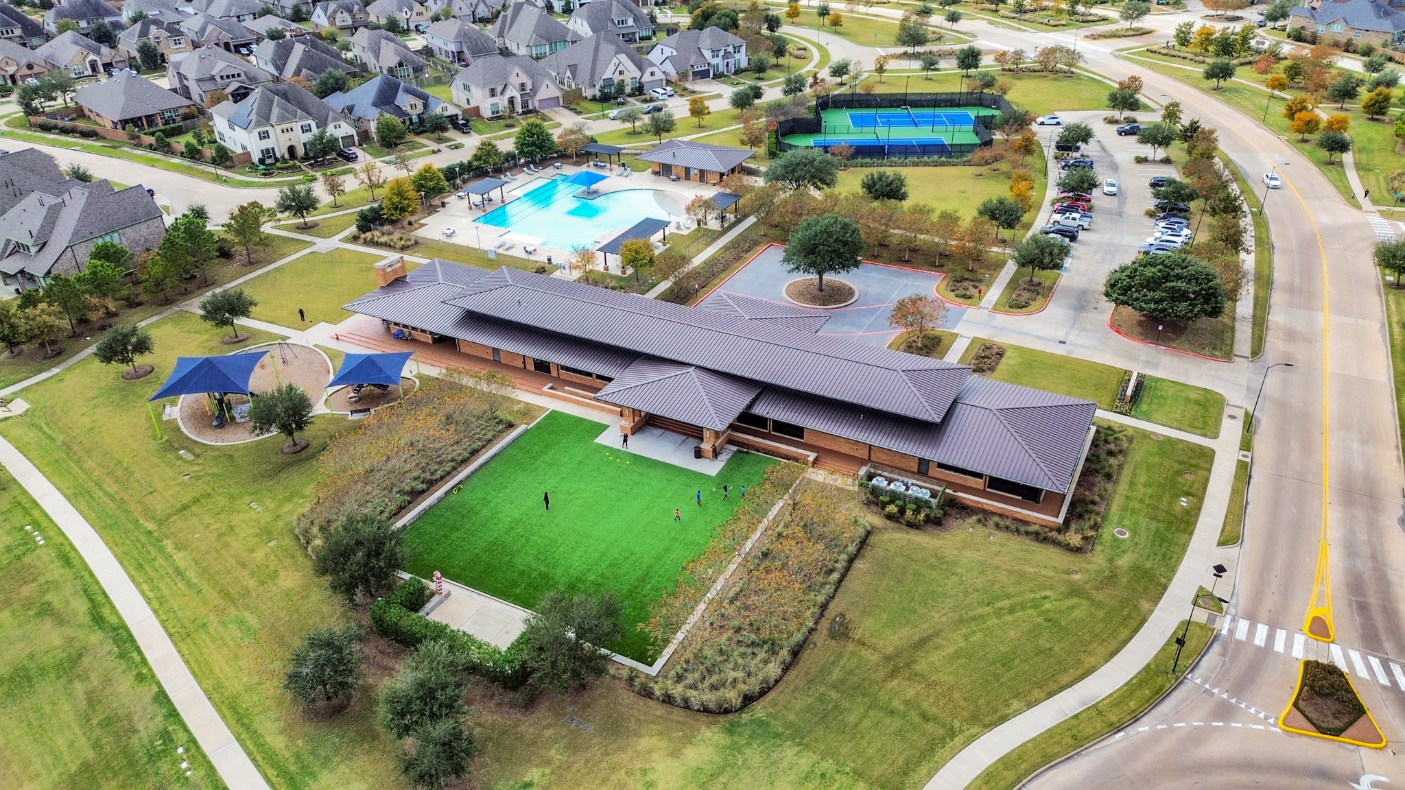 an aerial view of a house with a yard