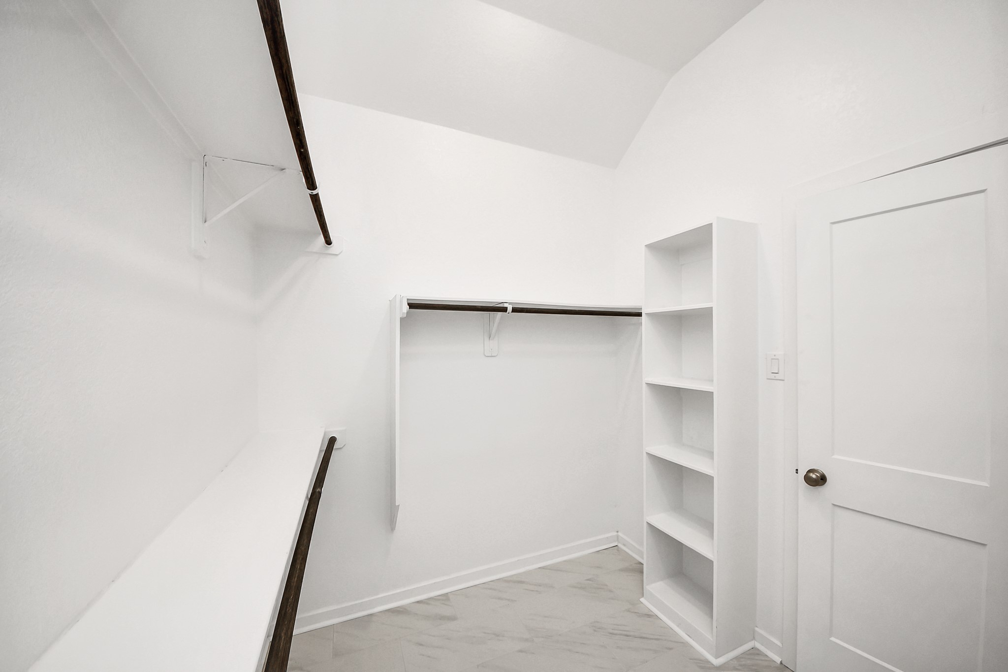6030 Rivercane Way Katy, TX 77493 - Photo 26 of 41 a view of walk in closet with empty racks