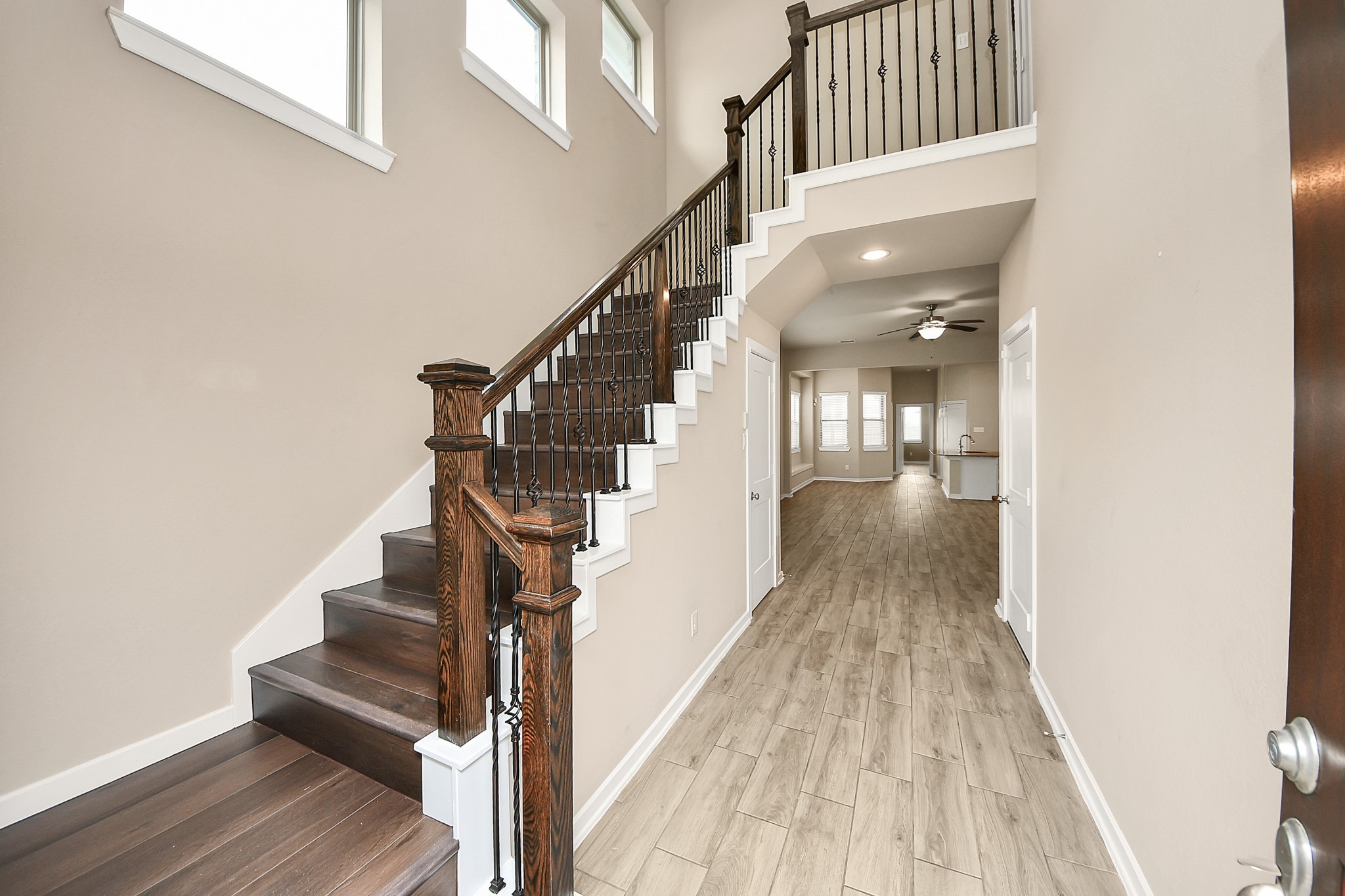 6030 Rivercane Way Katy, TX 77493 - Photo 9 of 41 a view of entryway and hall with wooden floor