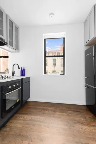 a kitchen with stainless steel appliances a stove and a refrigerator
