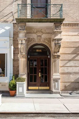 a view of a building with sitting area