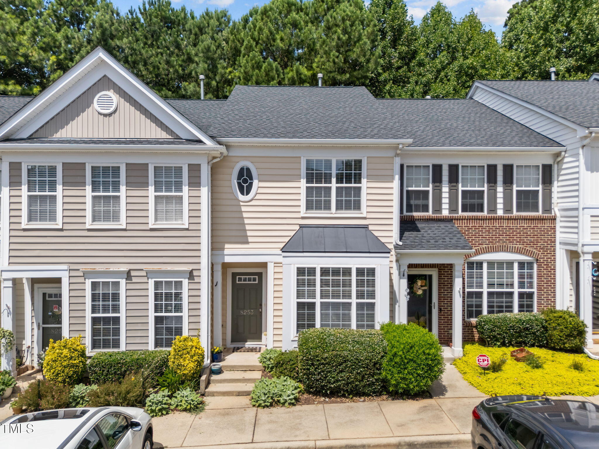 8253 City Loft Court Raleigh, NC 27613 - Photo 24 of 34 a front view of a house with a yard