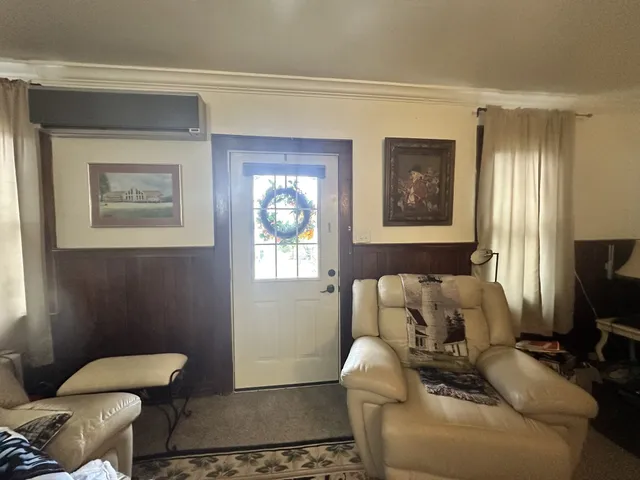 a living room with furniture and a window