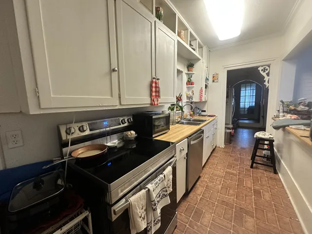 a kitchen with a stove and a sink