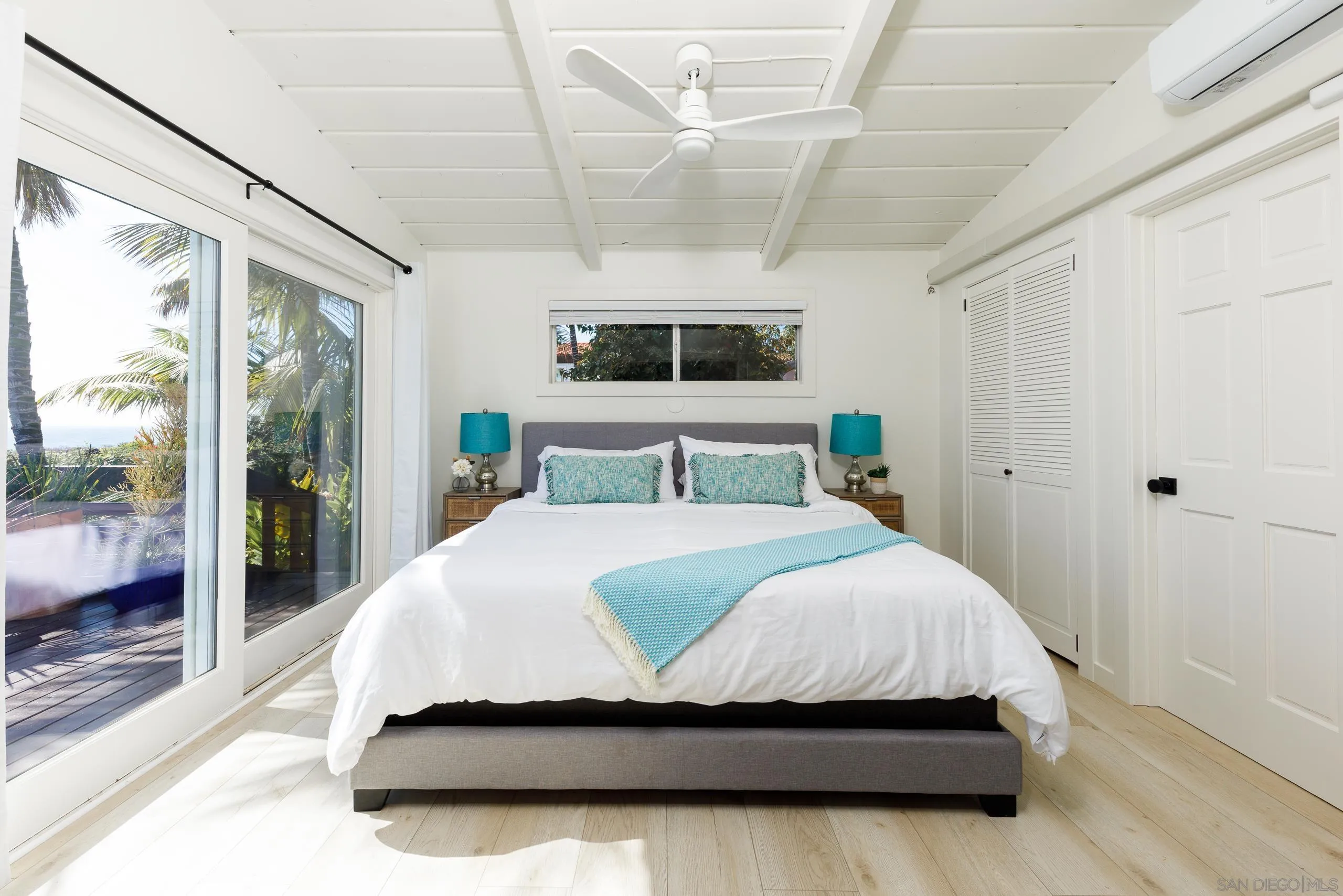 110 8th Street Del Mar, CA 92014 - Photo 15 of 45 a bedroom with a large bed and a large window