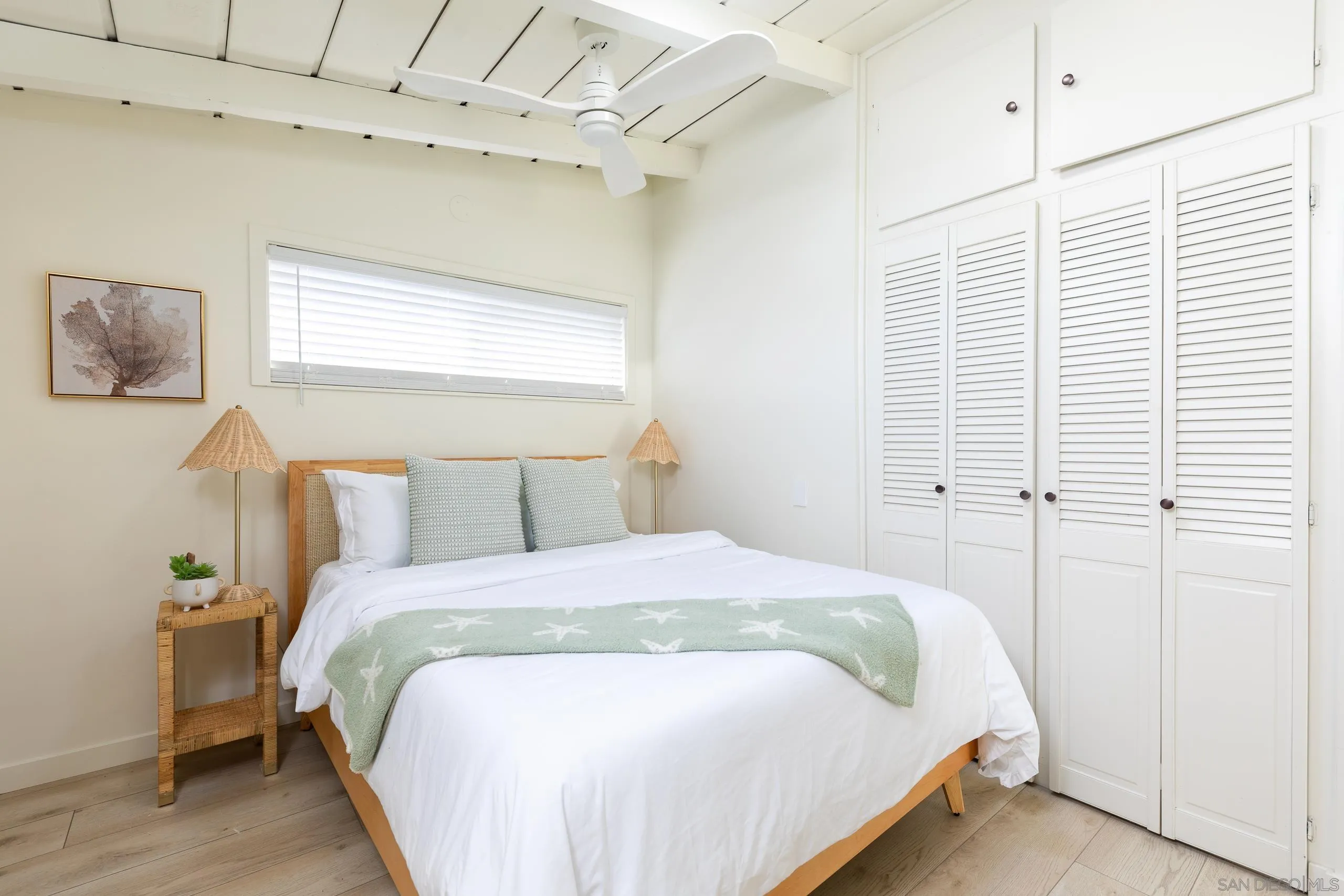 110 8th Street Del Mar, CA 92014 - Photo 21 of 45 a bedroom with a bed and a window