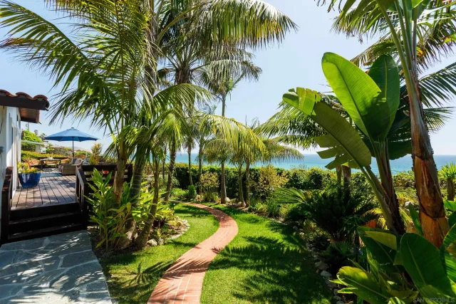 a view of a table and chairs under an umbrella