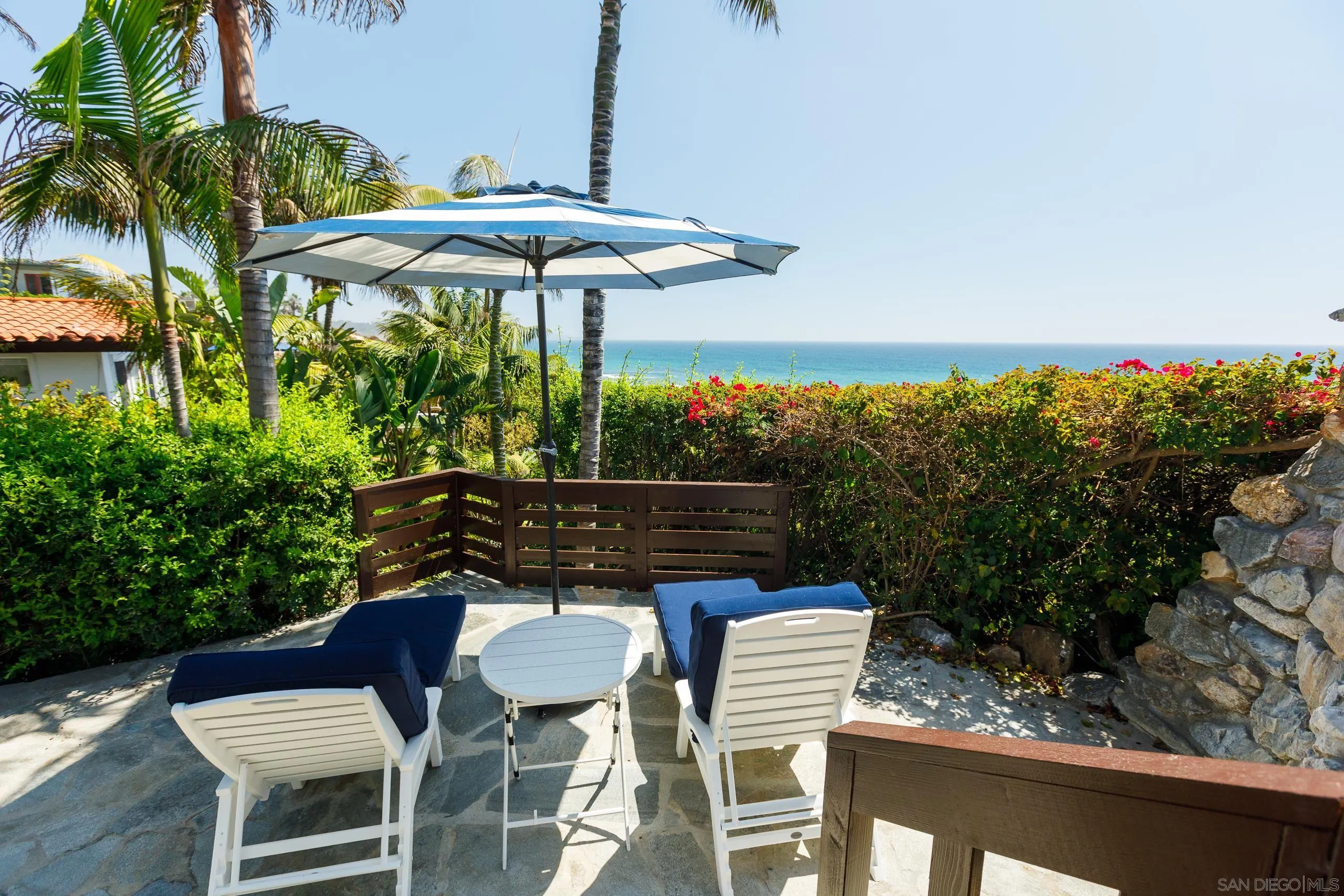 110 8th Street Del Mar, CA 92014 - Photo 25 of 45 a view of a table and chairs under an umbrella