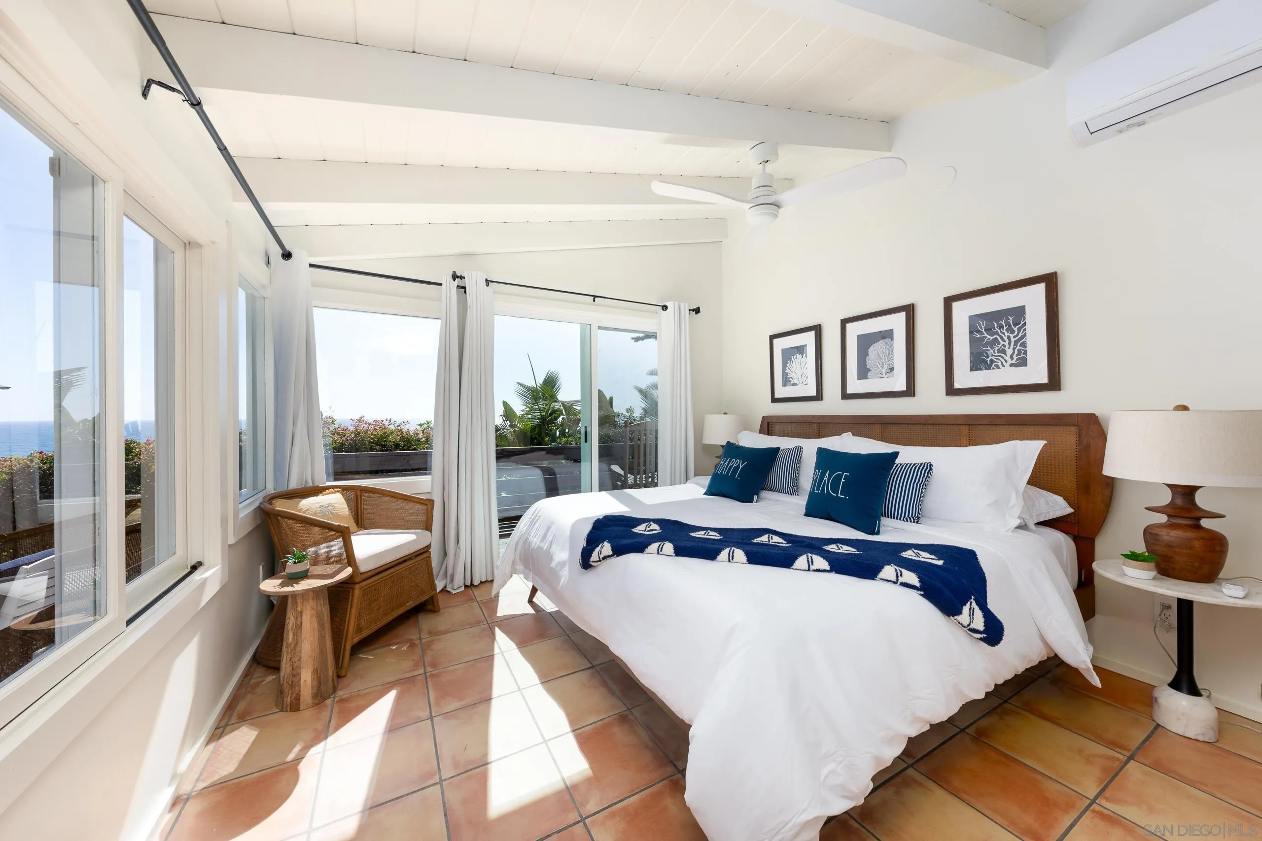 110 8th Street Del Mar, CA 92014 - Photo 30 of 45 a bed sitting in a bedroom next to a large window