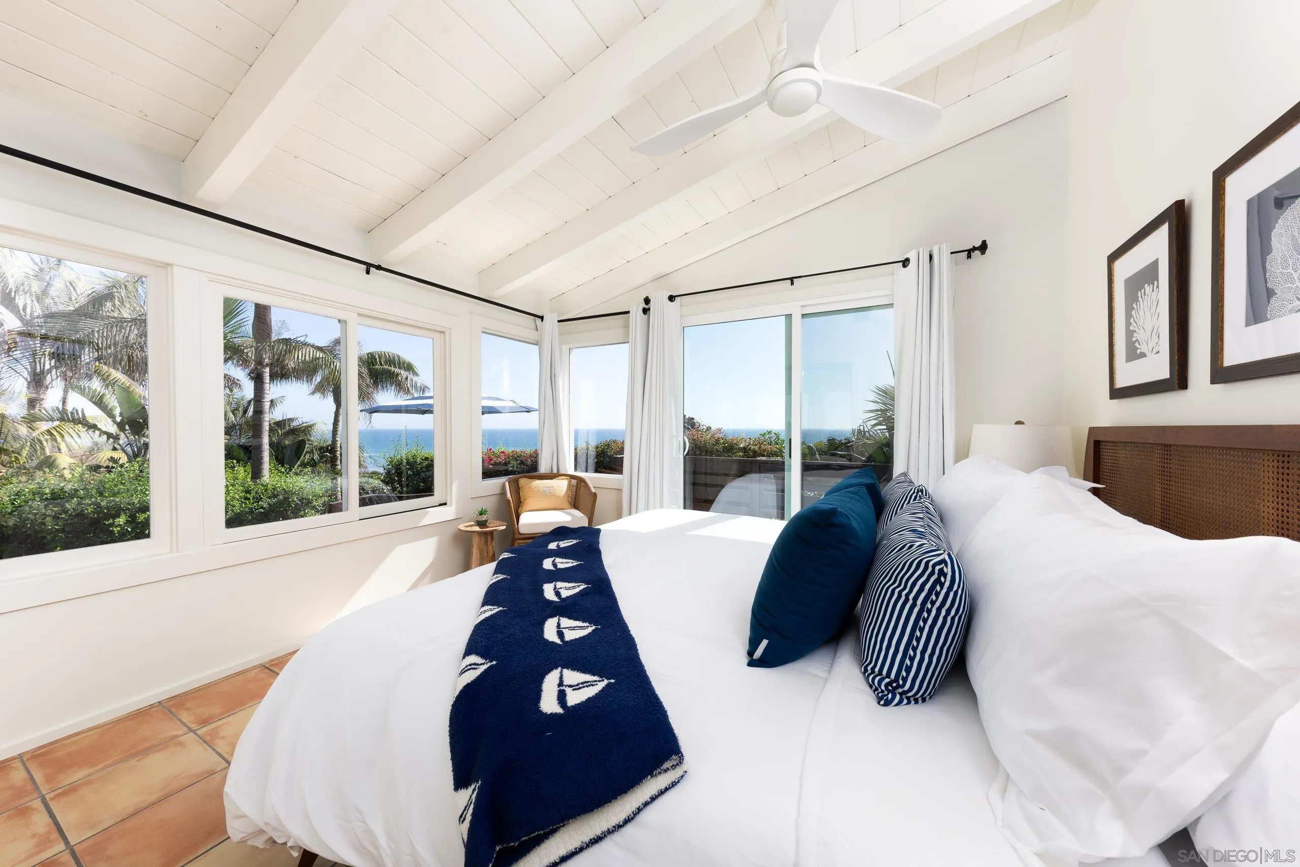 110 8th Street Del Mar, CA 92014 - Photo 31 of 45 a bed sitting in a bedroom next to a large window