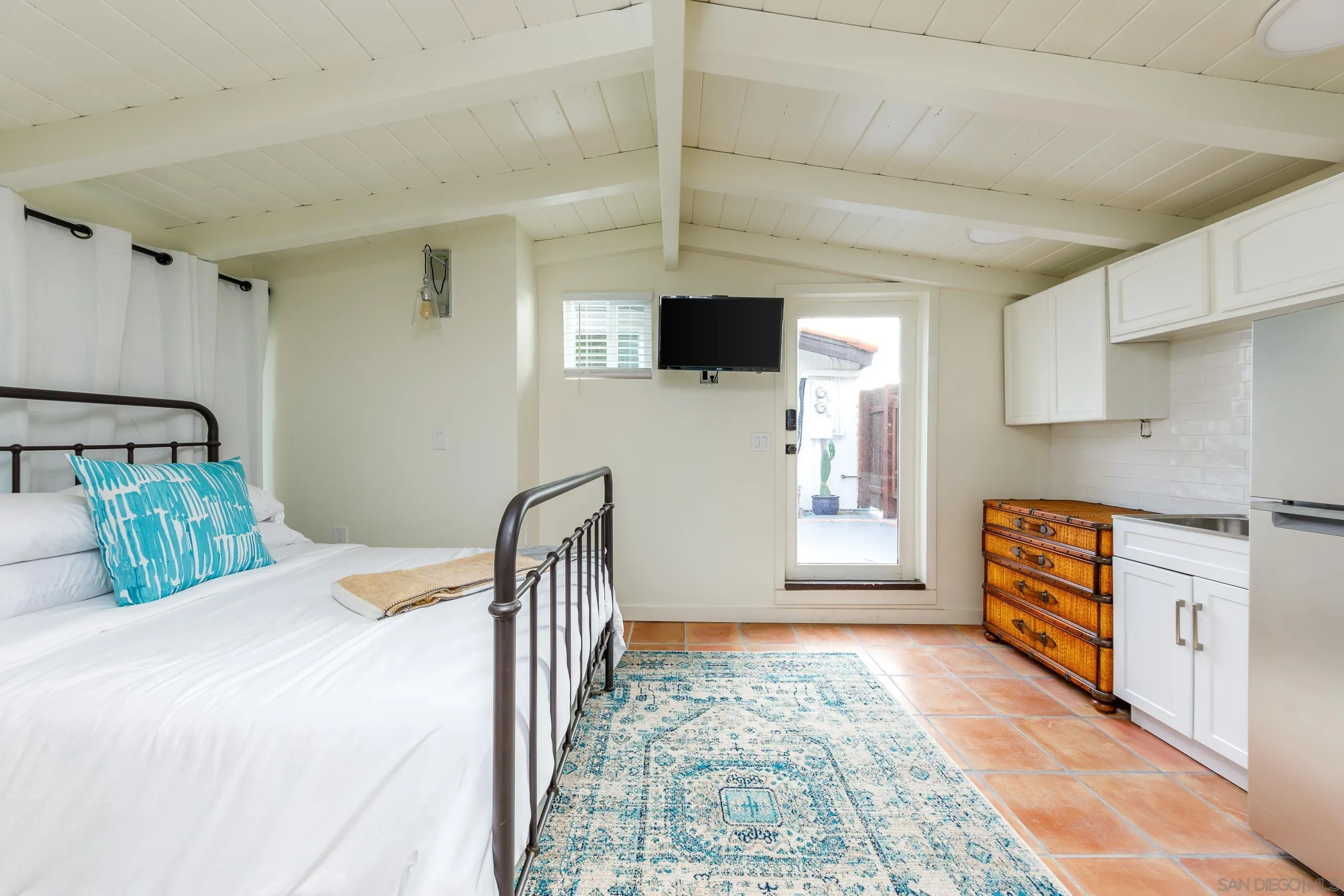 110 8th Street Del Mar, CA 92014 - Photo 36 of 45 a bedroom with a large bed and a window