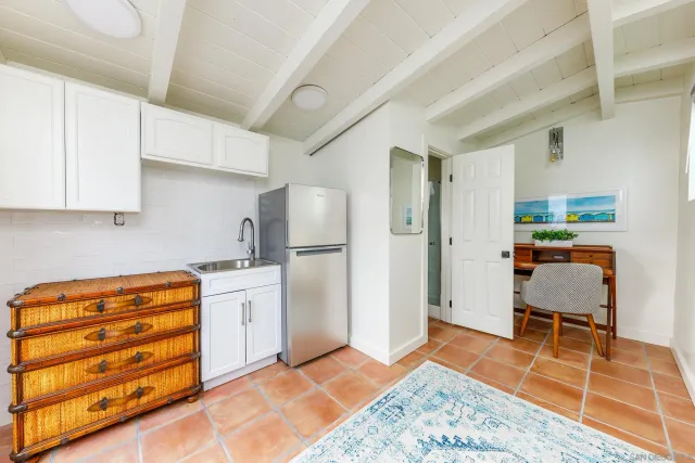 a view of hallway with furniture and a mirror