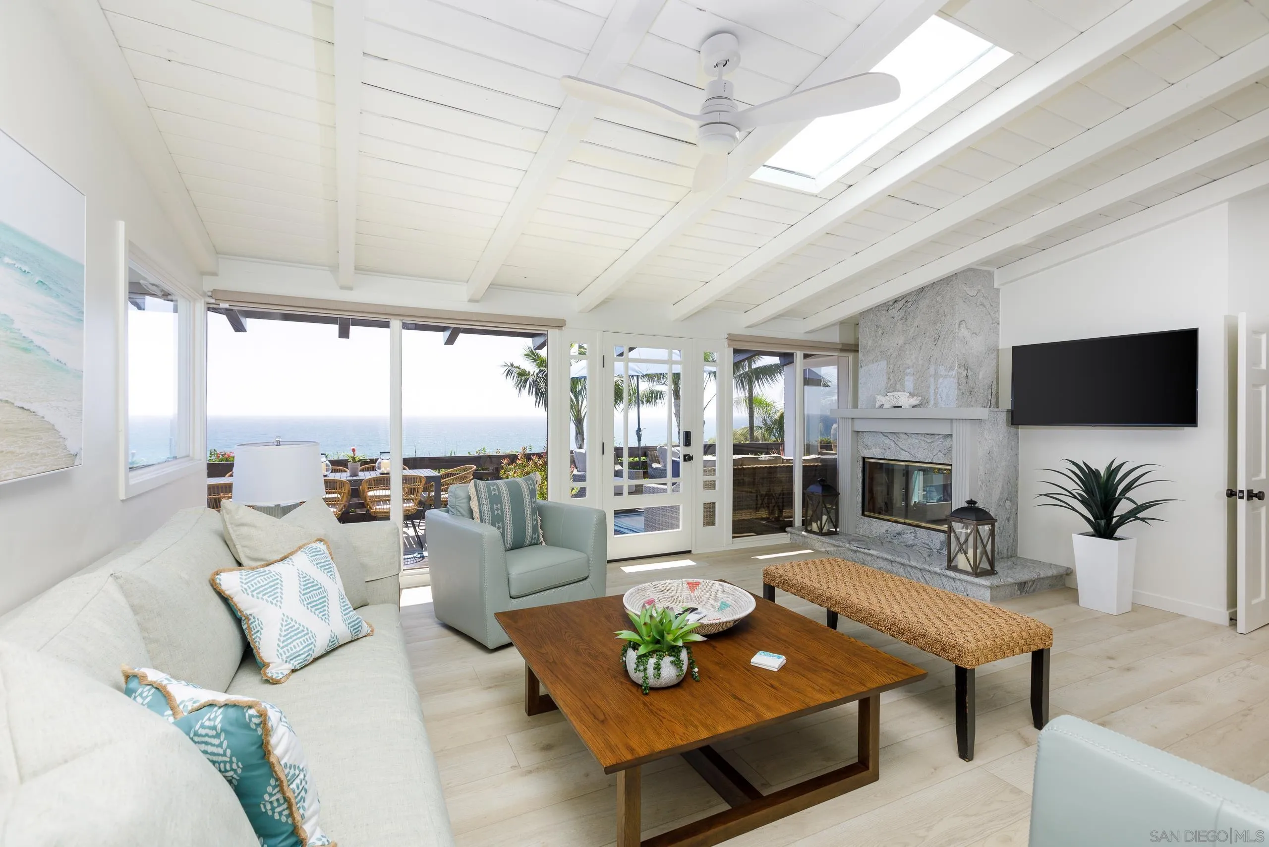 110 8th Street Del Mar, CA 92014 - Photo 7 of 45 a living room with furniture and a flat screen tv