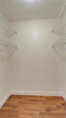 an aerial view of lake and residential houses with outdoor space