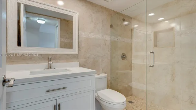 an aerial view of a city with lake view