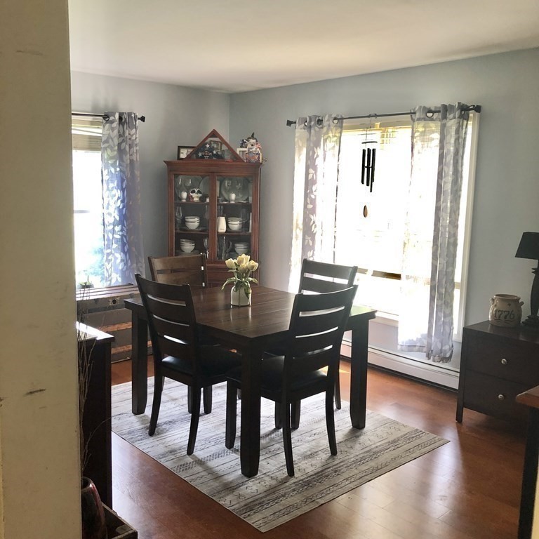 33 Bolton Road Clinton, MA 01510 - Photo 13 of 40 a view of a dining room with furniture window and wooden floor