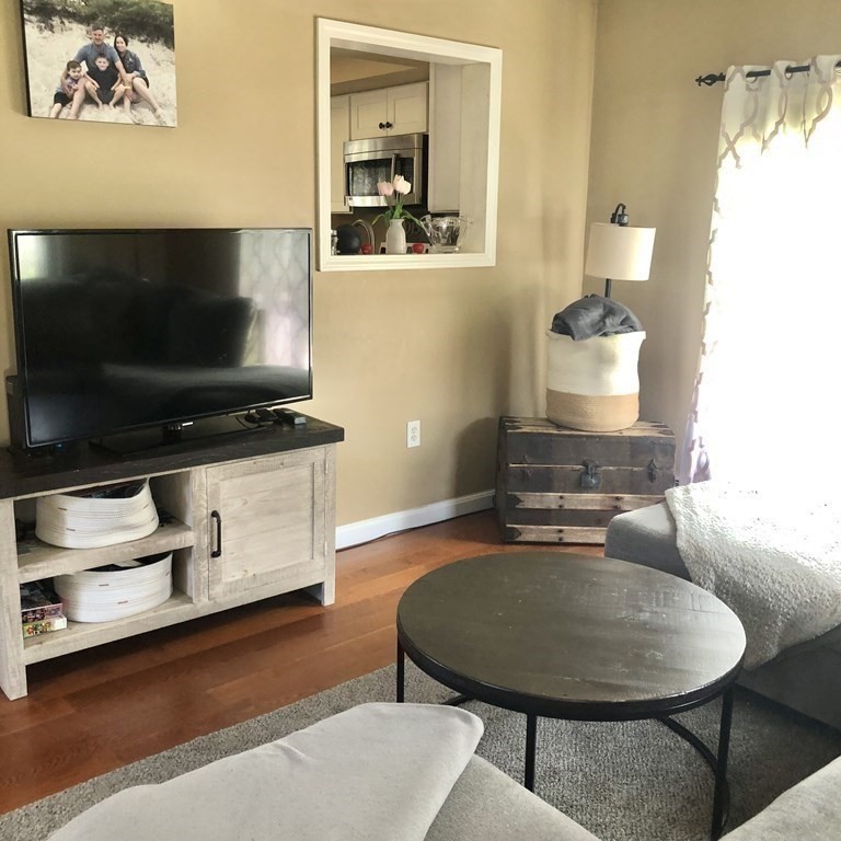 33 Bolton Road Clinton, MA 01510 - Photo 16 of 40 a living room with furniture and a flat screen tv