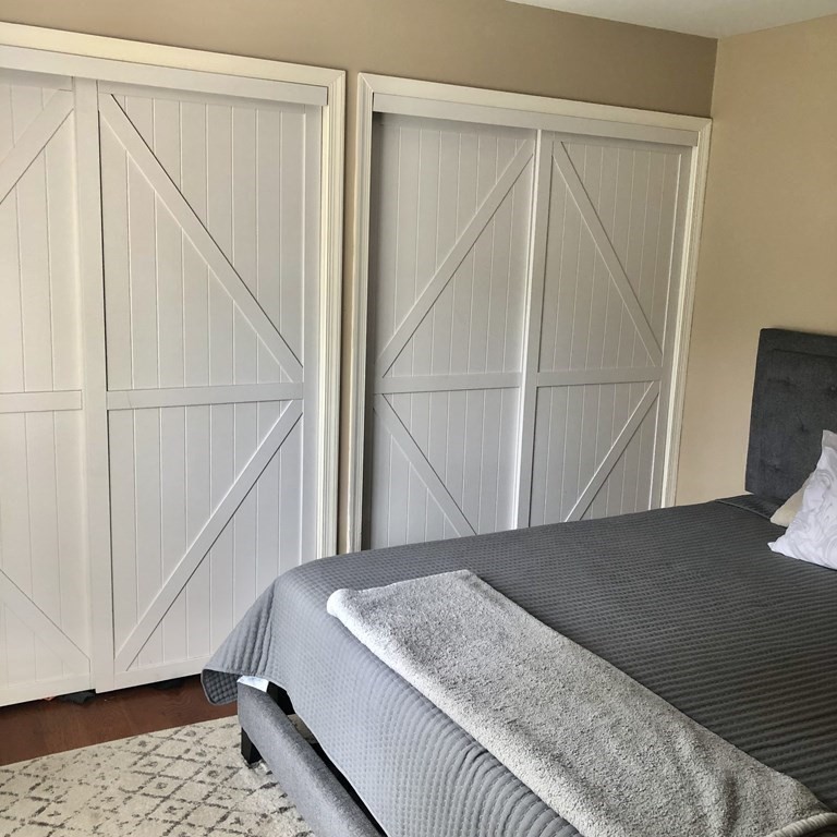 33 Bolton Road Clinton, MA 01510 - Photo 21 of 40 a bedroom with a bed and wooden floor