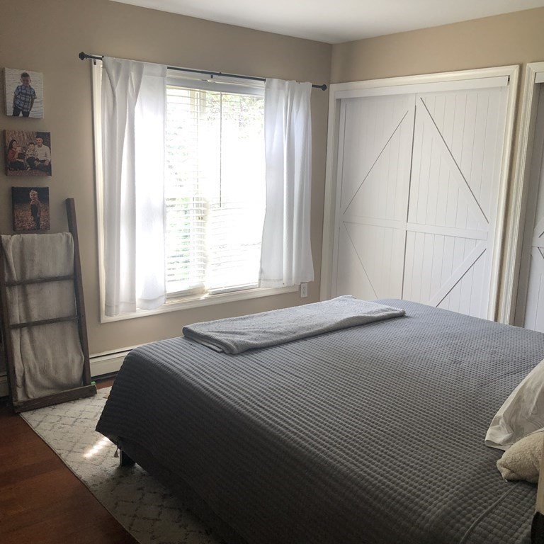 33 Bolton Road Clinton, MA 01510 - Photo 22 of 40 a bedroom with a bed and a window