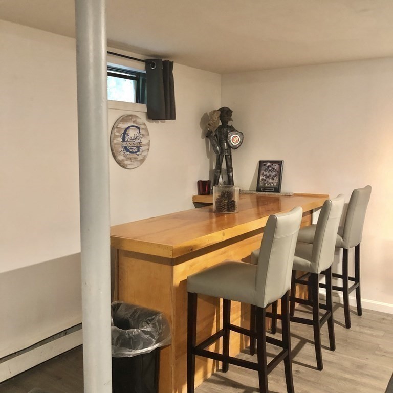 33 Bolton Road Clinton, MA 01510 - Photo 25 of 40 a dining room with a table and chairs