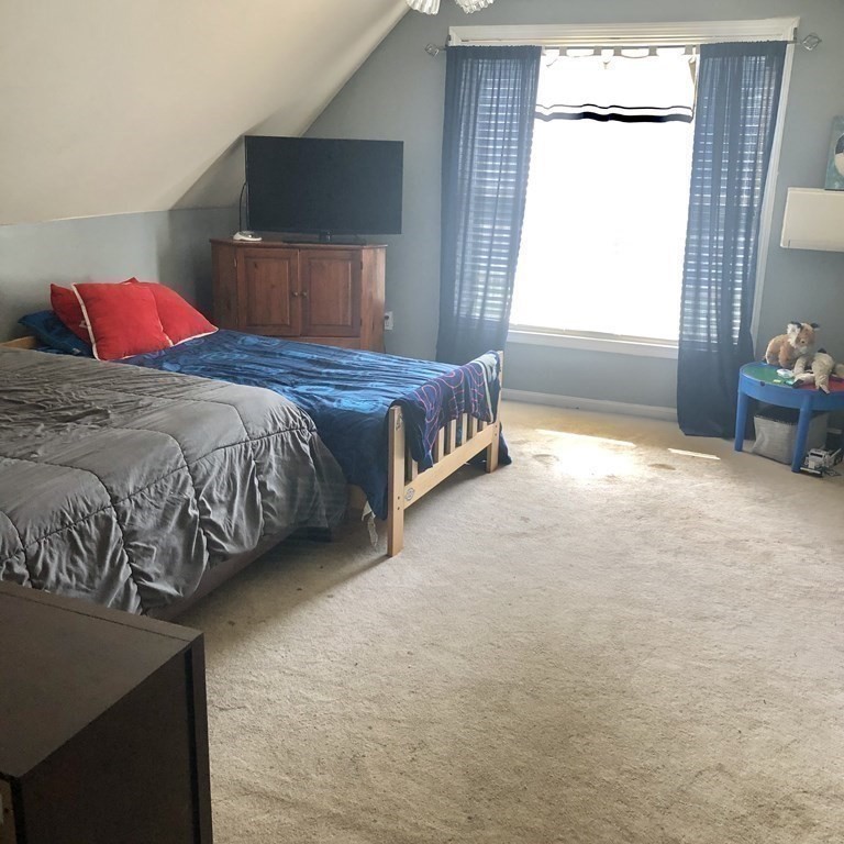 33 Bolton Road Clinton, MA 01510 - Photo 30 of 40 a bedroom with a bed and a window