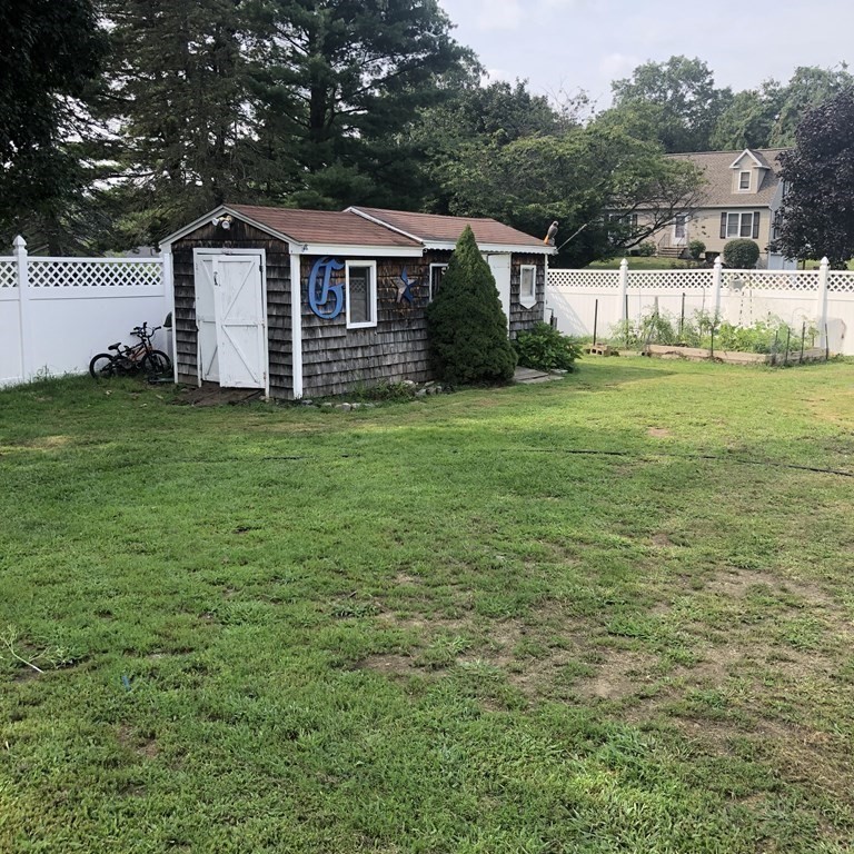 33 Bolton Road Clinton, MA 01510 - Photo 34 of 40 a front view of a house with a garden