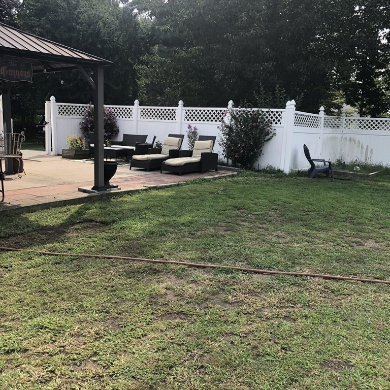 33 Bolton Road Clinton, MA 01510 - Photo 38 of 40 a view of a house with backyard and sitting area