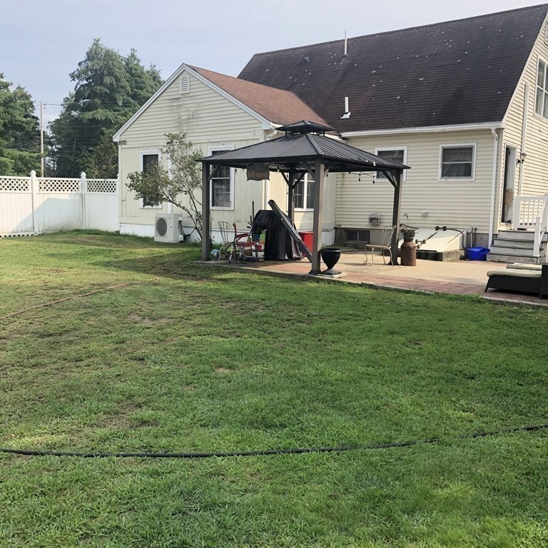 33 Bolton Road Clinton, MA 01510 - Photo 4 of 40 a view of a house with backyard porch and furniture