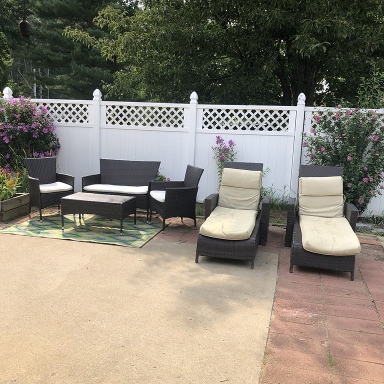 33 Bolton Road Clinton, MA 01510 - Photo 6 of 40 a view of a patio with couple of chairs