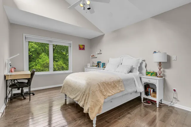 a bedroom with a bed and a table