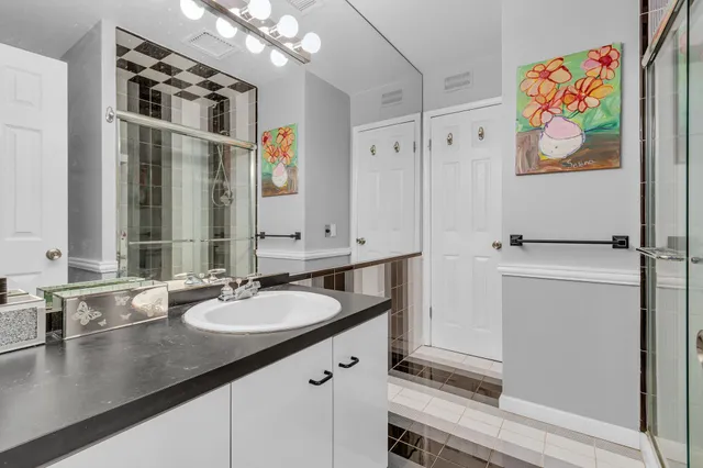 a bathroom with a sink a vanity and a mirror