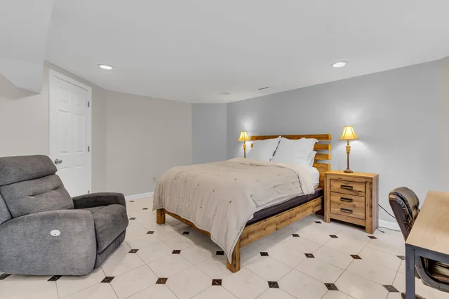 a bedroom with a bed and furniture