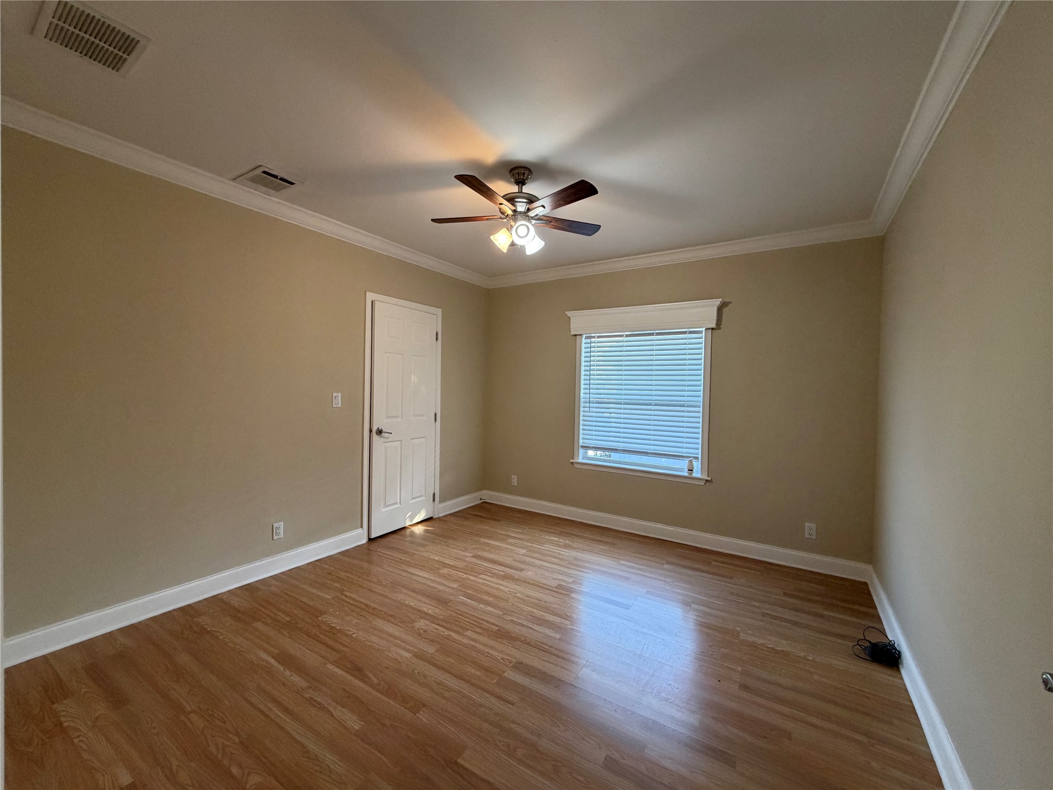 13021 Dessau Road, Unit 393 Austin, TX 78754 - Photo 7 of 10 Polished hardwood floors and elegant crown molding elevate this versatile, light-filled space.