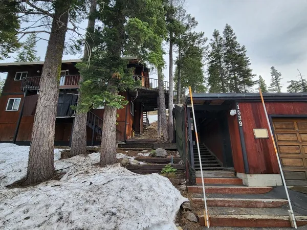 a backyard of a house with lots of green space
