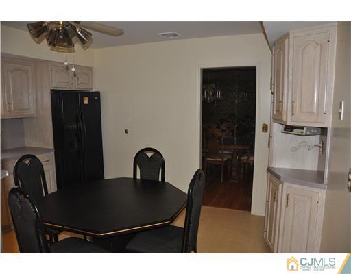 30 Warwick Road Edison, NJ 08820 - Photo 7 of 16 a view of a dining room with furniture and chandelier
