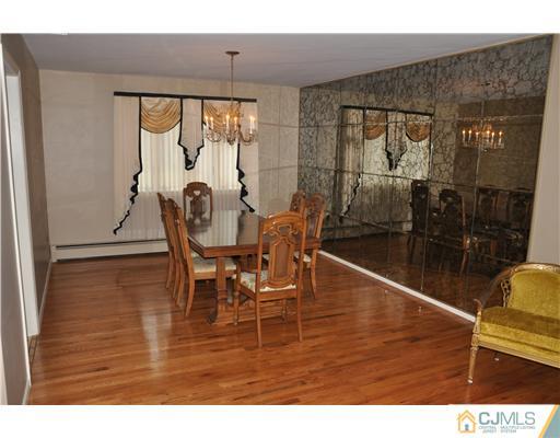 30 Warwick Road Edison, NJ 08820 - Photo 8 of 16 a view of a dining room with furniture and wooden floor