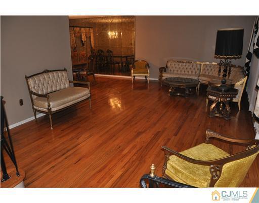 30 Warwick Road Edison, NJ 08820 - Photo 9 of 16 a living room with furniture and a flat screen tv