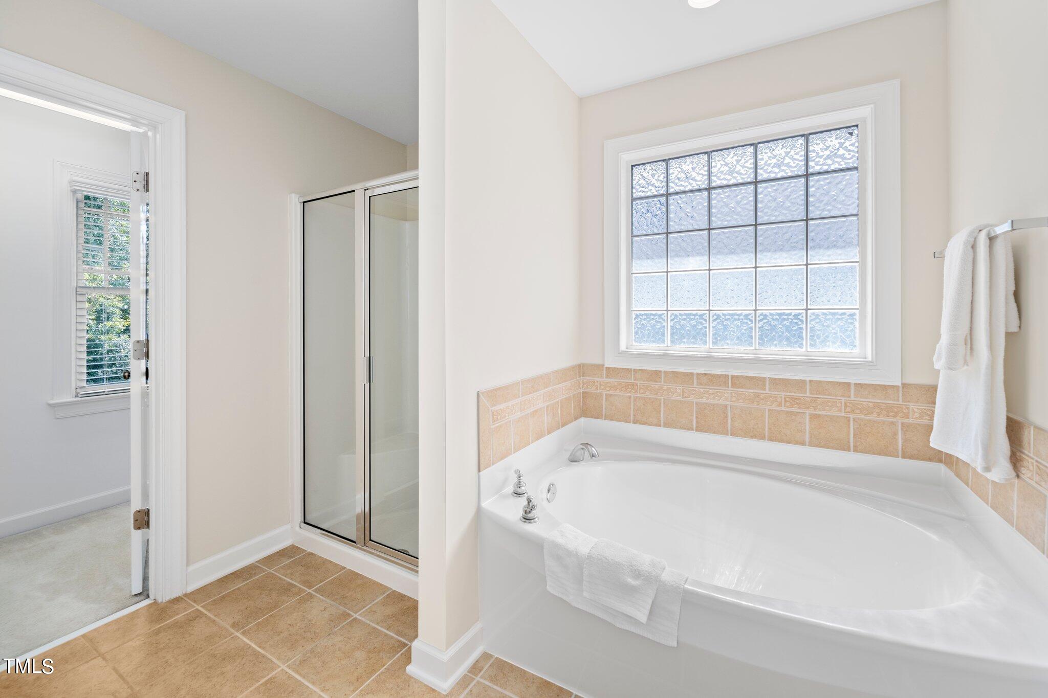 222 Homegate Circle Apex, NC 27502 - Photo 17 of 33 a white bath tub sitting next to a window