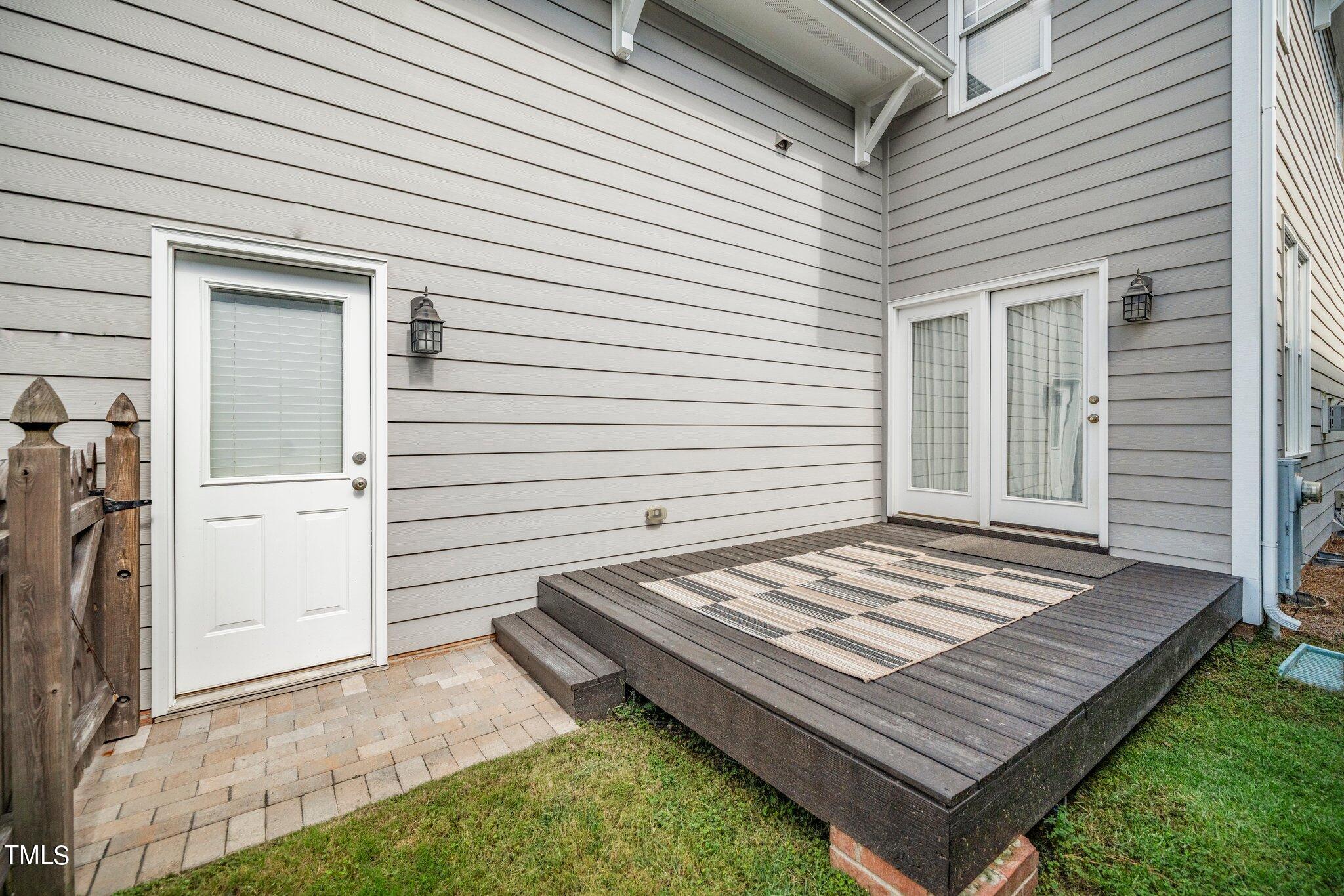 222 Homegate Circle Apex, NC 27502 - Photo 23 of 33 a view of a backyard with a wooden roof