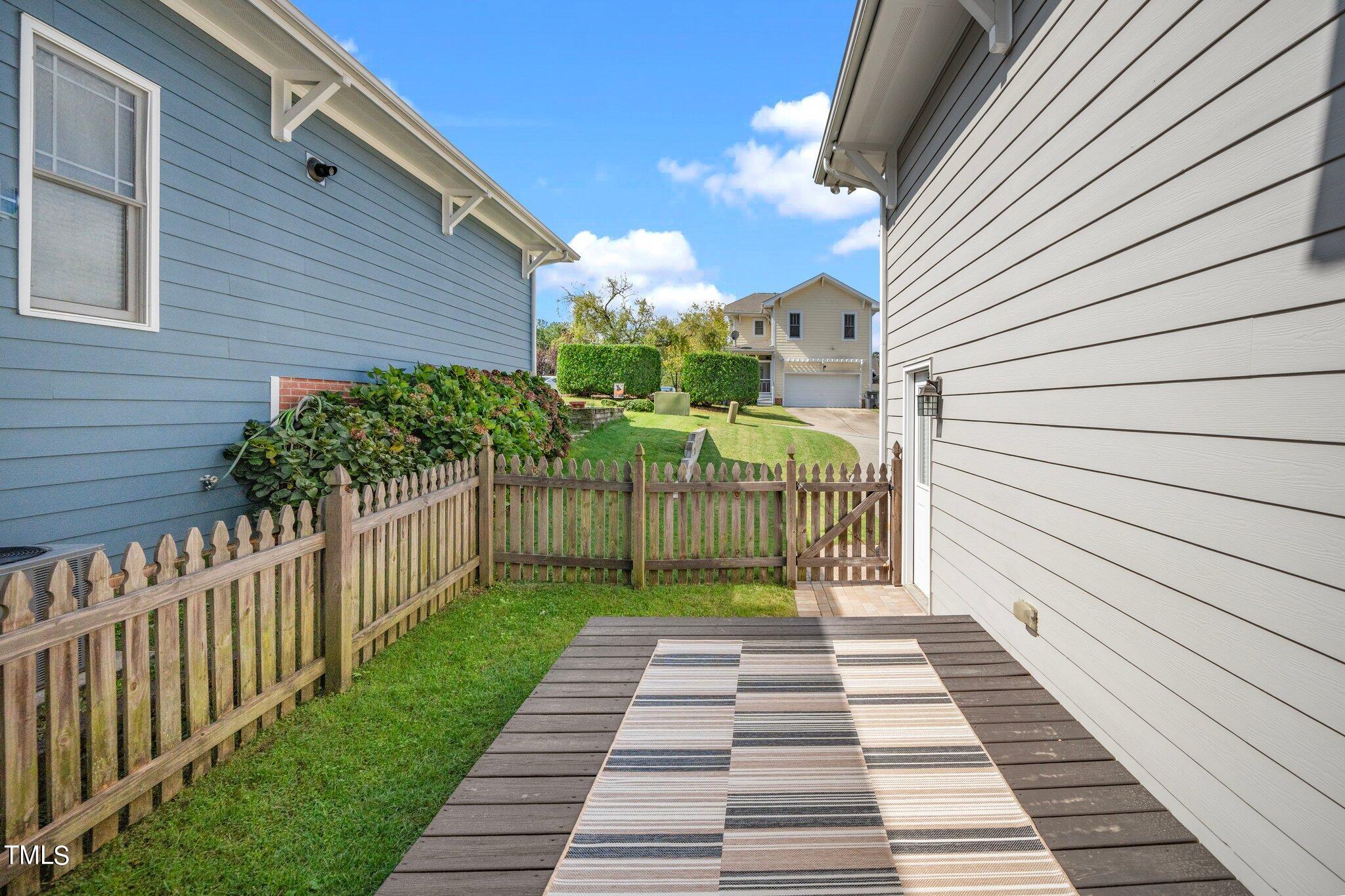 222 Homegate Circle Apex, NC 27502 - Photo 24 of 33 a view of a pathway with a house