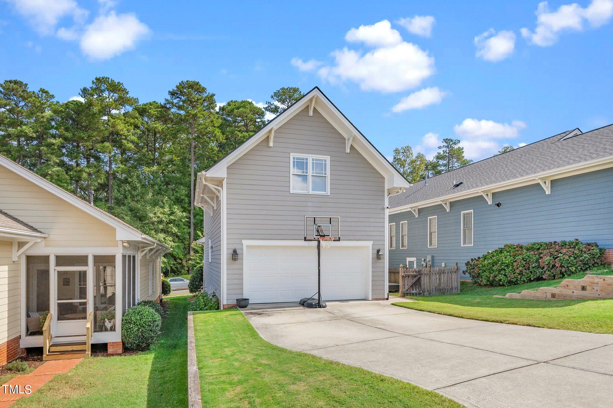 222 Homegate Circle Apex, NC 27502 - Photo 25 of 33 a view of a house with a yard and potted plants